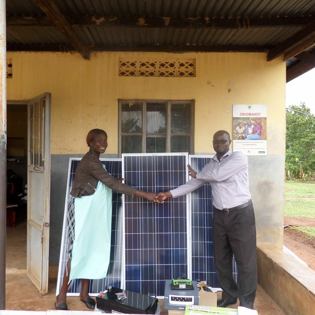 Solar panels and inverters donated by MUCHAP to Busowobi. Photo